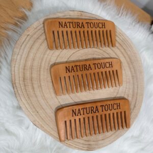 Natural wooden comb for gentle detangling and eco-friendly hair care.